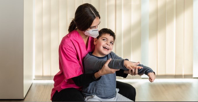 Child with medical needs and physiotherapist