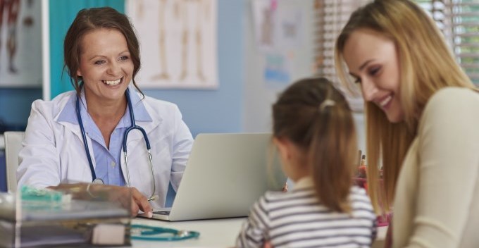 Mother and daughter visit to a health care provider